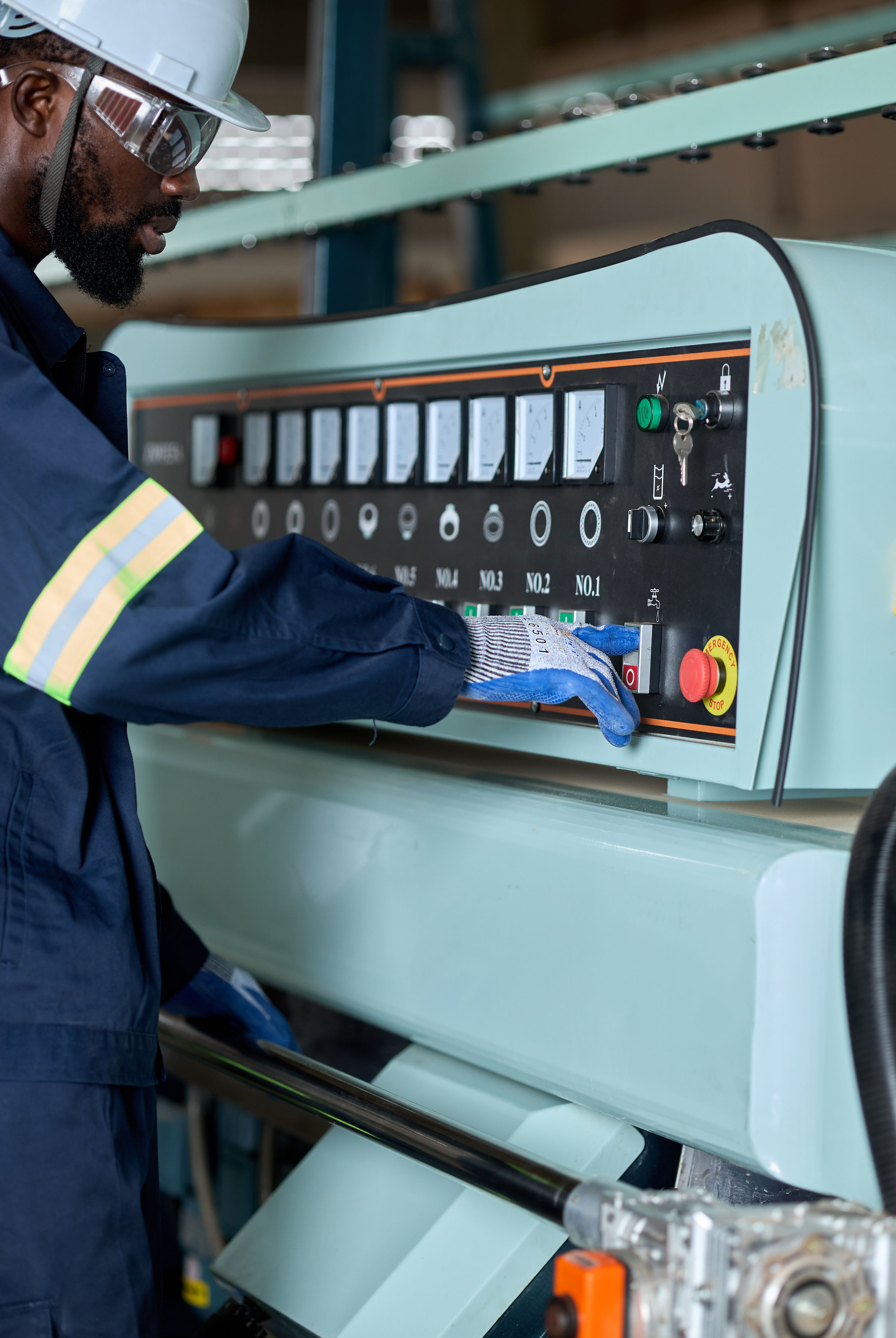 Smiling Black man working with glass equipment