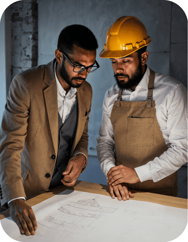 Two men looking at blueprints